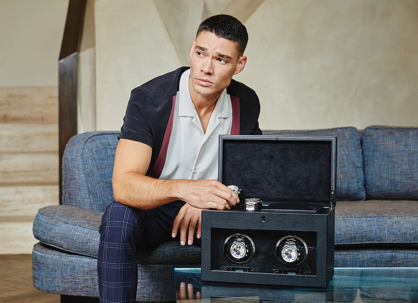 a boy with watch winder